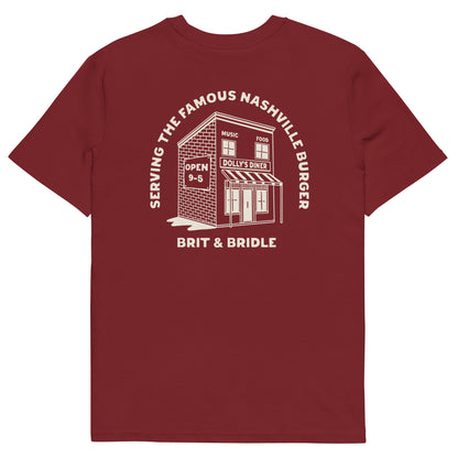 A white short-sleeve t-shirt with a large white graphic print on the back. The graphic features an illustration of a diner building with the text 'SERVING THE FAMOUS NASHVILLE BUNGER' arched above it and 'BRIT & BRIDLE' printed below.
