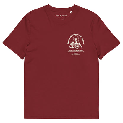A short-sleeve crewneck t-shirt with a vintage-style white graphic on the left chest. The graphic features a stylized portrait of Dolly Parton with the text 'Everyone's Welcome at Dolly's' and 'Dolly's Open 9-5 Mon-Sun'.